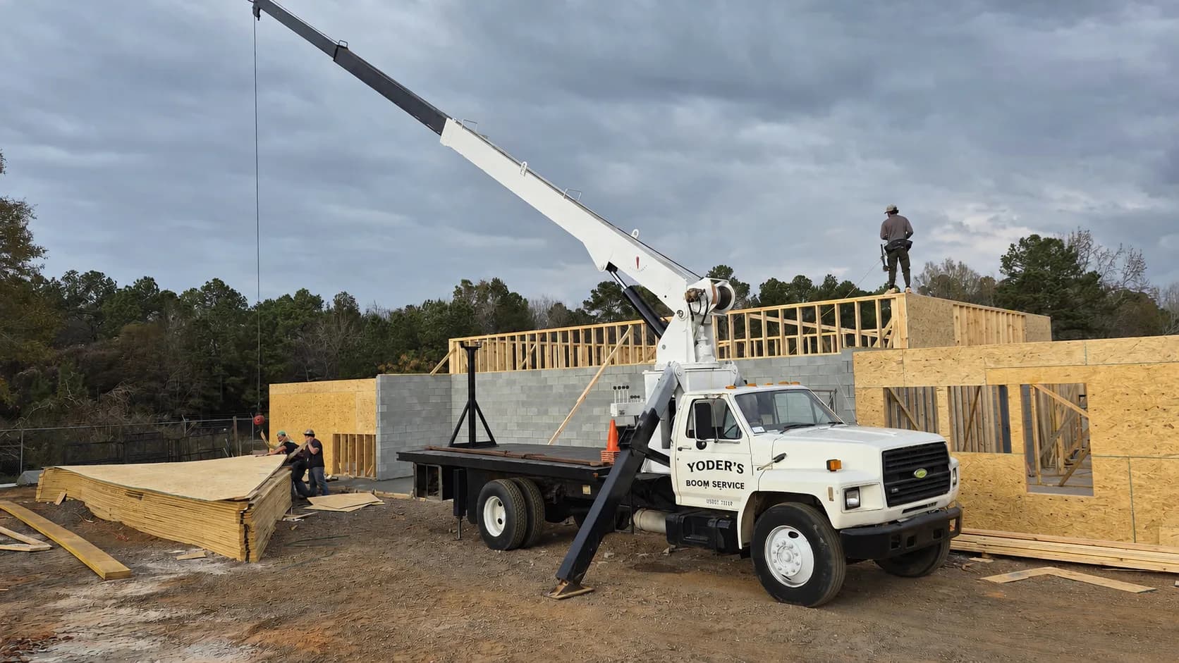 Yoder's Boom Service boom truck lifting on a jobsite in Upstate South Carolina